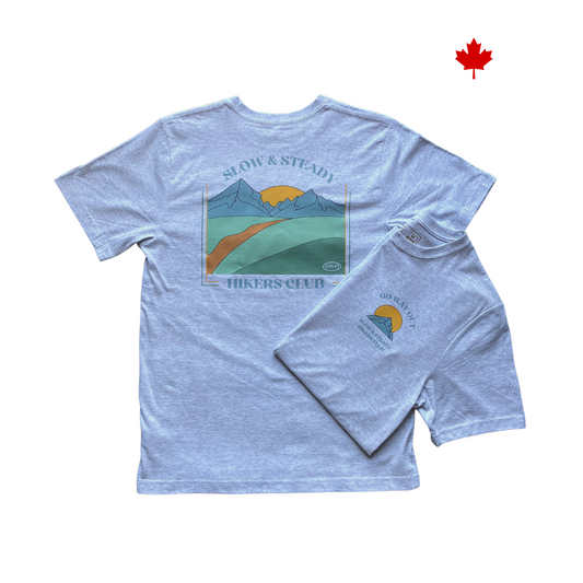 Slow & Steady Hikers Club text surrounding a colorful mountain and sun t-shirt design. 